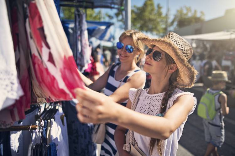 two women shopping outside