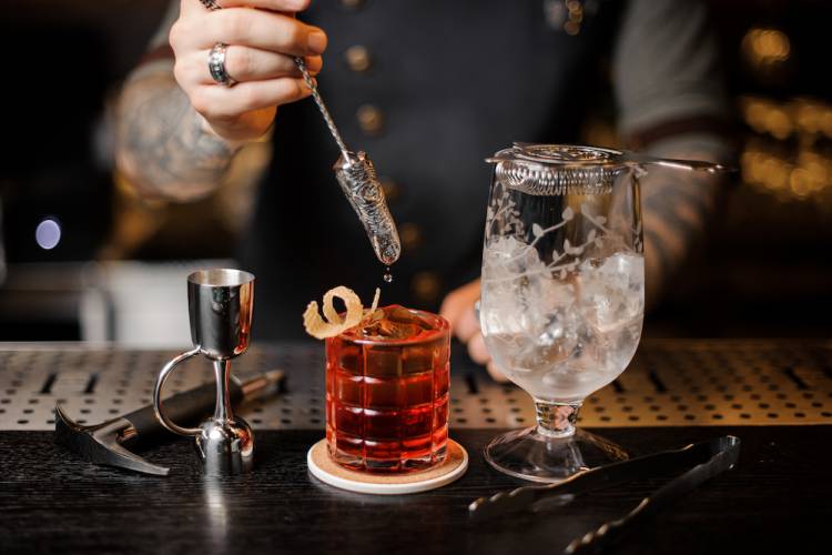 bartender finishing making a cocktail