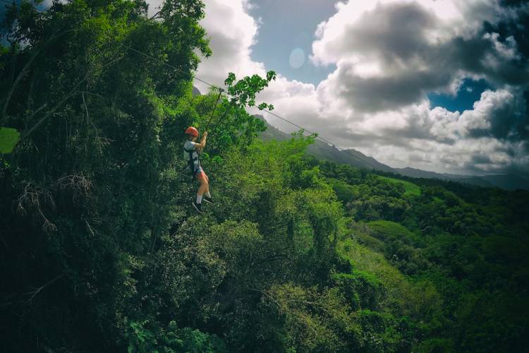 person zip-lining in Hawaii